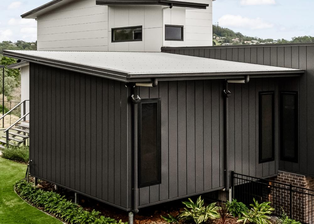 House with DOMINION steel walling manufactured from COLORBOND steel in colour Ironstone