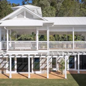 Queenslander house on Mogill Road QLD with custom orb roofing in surfmist