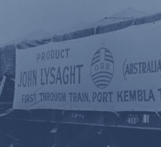 A photo of the first through train from Port Kembla to Melbourne, loaded with Lysaght ORB roofing