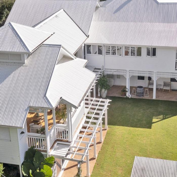 Queenslander House on Mogill Road QLD with custom orb roofing in surfmist