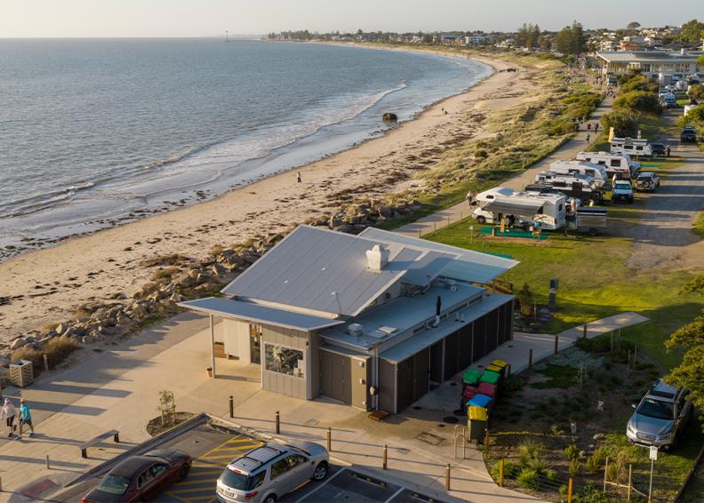 Coastal building with Lysaght CUSTOM ORB® roofing and seamless indoor - outdoor flow 