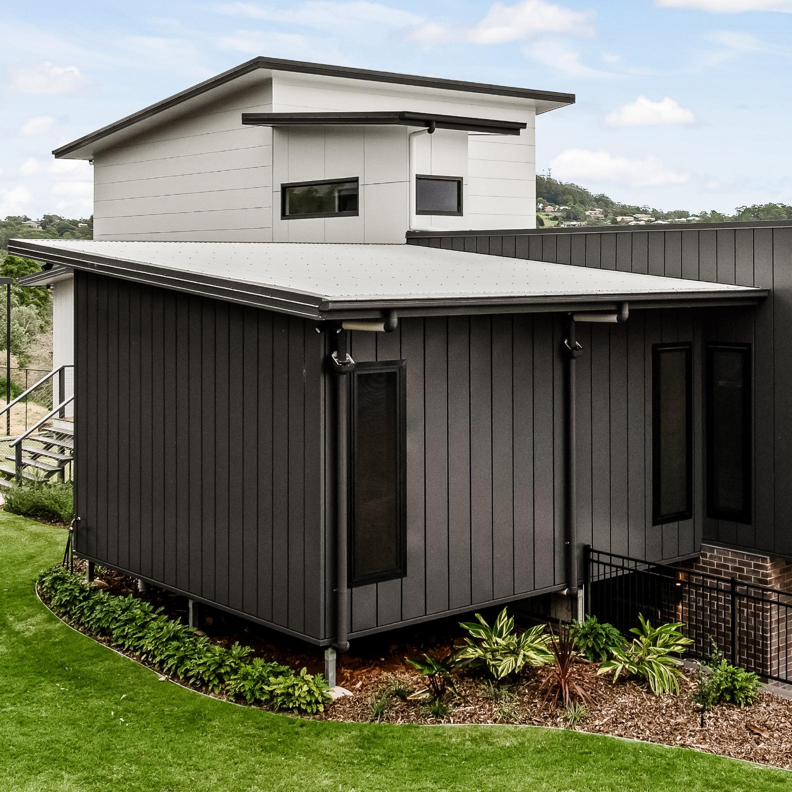 House with DOMINION steel walling manufactured from COLORBOND steel in colour Ironstone