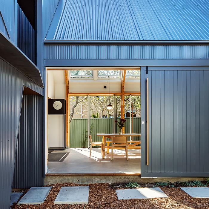 Contemporary residential extension featuring COLORBOND® steel Basalt® cladding with seamless indoor-outdoor integration.